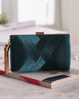 an elegant silk clutch, featuring a smooth texture and timeless design, ideal for enhancing your formal attire