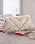a Pearl Clutch, a classic and elegant accessory perfect for formal occasions and special events