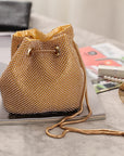 an image of the Exquisite Embellished Evening Bag. The bag features intricate embellishments, creating a stunning and luxurious accessory for special occasions. It is designed for versatility, allowing it to be worn as both a shoulder bag and a handheld clutch. Elevate your elegance with this timeless and captivating evening bag.