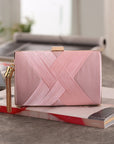 an elegant silk clutch, featuring a smooth texture and timeless design, ideal for enhancing your formal attire