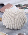 a Handcrafted Bead Embroidery Evening Bag with a Shell-Inspired Design, a stunning and unique accessory perfect for formal events and special occasions.