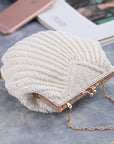 a Handcrafted Bead Embroidery Evening Bag with a Shell-Inspired Design, a stunning and unique accessory perfect for formal events and special occasions.
