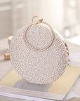 a Pearl and Diamond Evening Bag: Timeless Elegance in Hand, a sophisticated and luxurious accessory perfect for formal events and special occasions