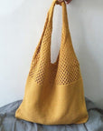 a Crochet Tote Bag, a chic and handcrafted accessory perfect for various occasions, from casual outings to beach trips.