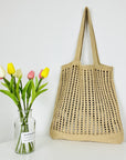 a Crochet Tote Bag, a sustainable and stylish accessory perfect for eco-conscious fashion enthusiasts.