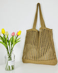 a Crochet Tote Bag, a sustainable and stylish accessory perfect for eco-conscious fashion enthusiasts.