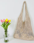 Elegant Crochet Shoulder Bag in Natural Fibers, a chic accessory for ethical fashion enthusiasts.