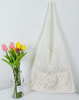 Elegant Crochet Shoulder Bag in Natural Fibers, a chic accessory for ethical fashion enthusiasts.