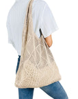 Elegant Crochet Shoulder Bag in Natural Fibers, a chic accessory for ethical fashion enthusiasts.