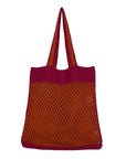 Handcrafted crochet shoulder bag in earthy tones with boho-inspired design.