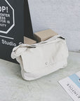 Upgrade Your Style with Our Sleek Canvas Crossbody Bag