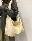 Get Ready to Conquer Your Day with Our Stylish and Spacious Canvas Crossbody Bag