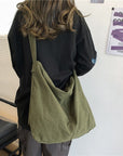 Get Ready to Conquer Your Day with Our Stylish and Spacious Canvas Crossbody Bag