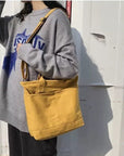 Durable Canvas Shoulder Bag with Adjustable Strap for All Occasions