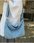 Find Your Perfect Match: Our Denim Crossbody Bag Comes in a Variety of Sizes and Styles