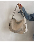 Stay Organized On-the-Go with Our Canvas Crossbody Bag