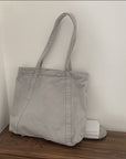 Carry Your World with Our Waxed Canvas Tote