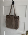 Carry Your World with Our Waxed Canvas Tote
