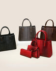 Three-piece crocodile-textured faux leather bag set featuring a spacious tote bag with sturdy handles, a compact mini handbag with a stylish flap closure, and a matching wallet. The set exudes elegance with its bold red color and sophisticated crocodile pattern, perfect for various occasions.