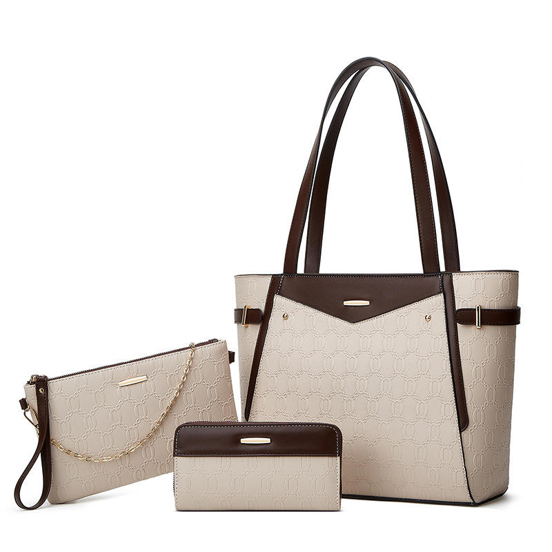 Elegant leather bag set featuring a textured geometric design, perfect for versatile use as a tote, clutch, and wallet.