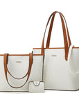 Three-piece leather bag set featuring a dual-tone design with a white body and camel-brown accents, including a large tote bag, a medium shoulder bag, and a compact wallet. The set offers a sophisticated and versatile style for everyday use.