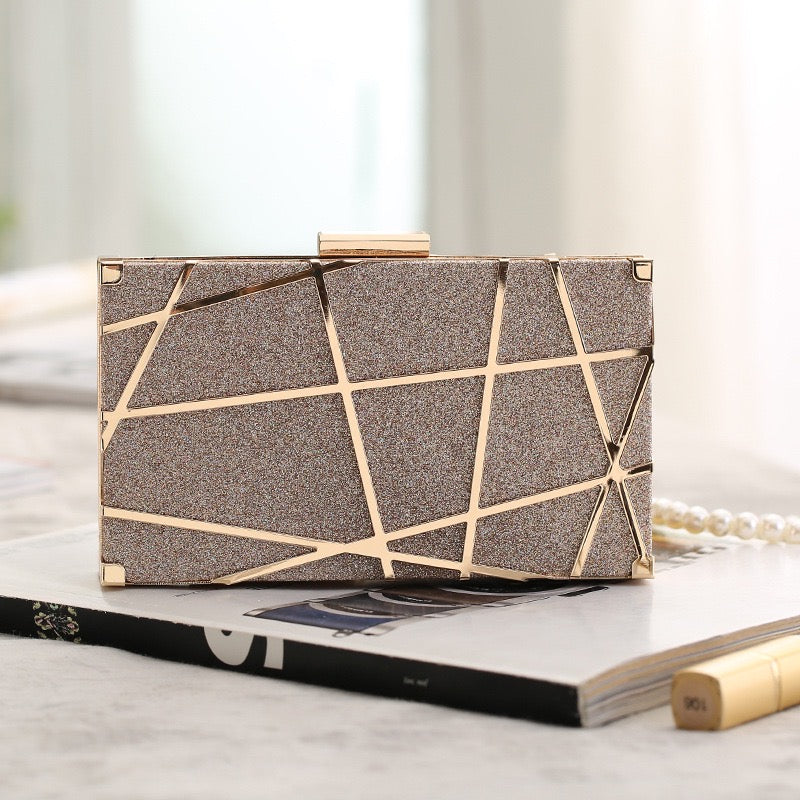 Sleek and Sophisticated Evening Clutch. It is a classic and elegant accessory designed for formal events, combining style and functionality. The clutch features a sleek and sophisticated design in black, making it the perfect complement to your special evening ensemble.