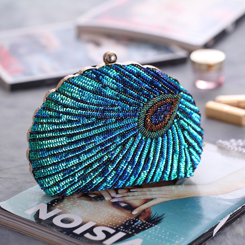 the Bead Embroidery and Sequin Evening Bag, an exquisite accessory crafted with intricate bead embroidery and shimmering sequins. It is designed for special occasions and perfectly complements qipao ensembles, showcasing elegance and sophistication.