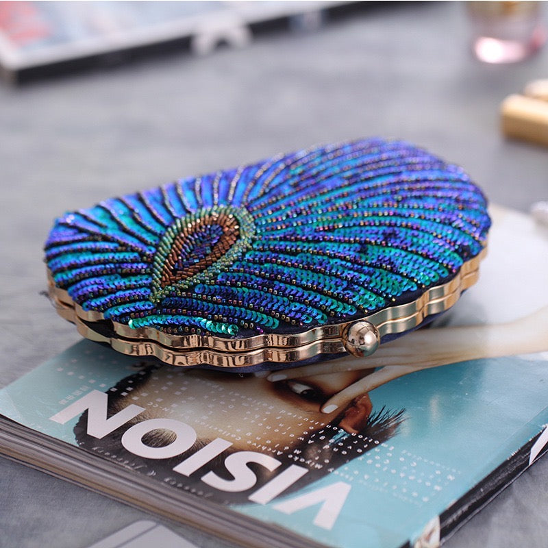 the Bead Embroidery and Sequin Evening Bag, an exquisite accessory crafted with intricate bead embroidery and shimmering sequins. It is designed for special occasions and perfectly complements qipao ensembles, showcasing elegance and sophistication.