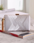 an elegant silk clutch, featuring a smooth texture and timeless design, ideal for enhancing your formal attire