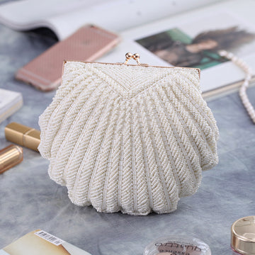 a Handcrafted Bead Embroidery Evening Bag with a Shell-Inspired Design, a stunning and unique accessory perfect for formal events and special occasions.