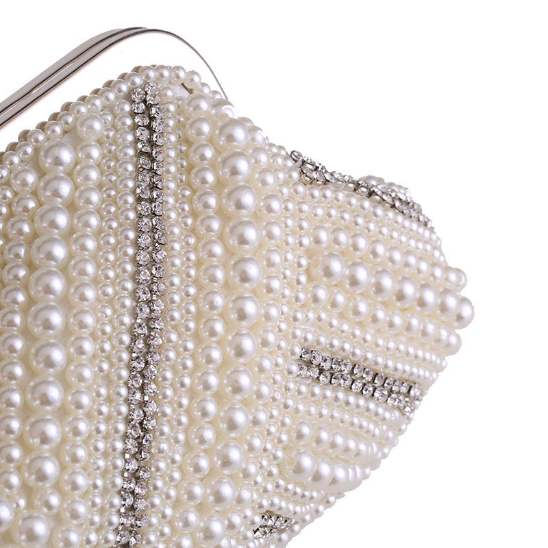 a Pearl Clutch, a classic and elegant accessory perfect for formal occasions and special events