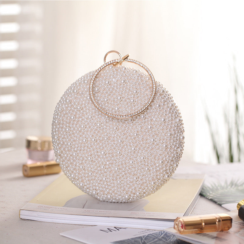 a Pearl and Diamond Evening Bag: Timeless Elegance in Hand, a sophisticated and luxurious accessory perfect for formal events and special occasions