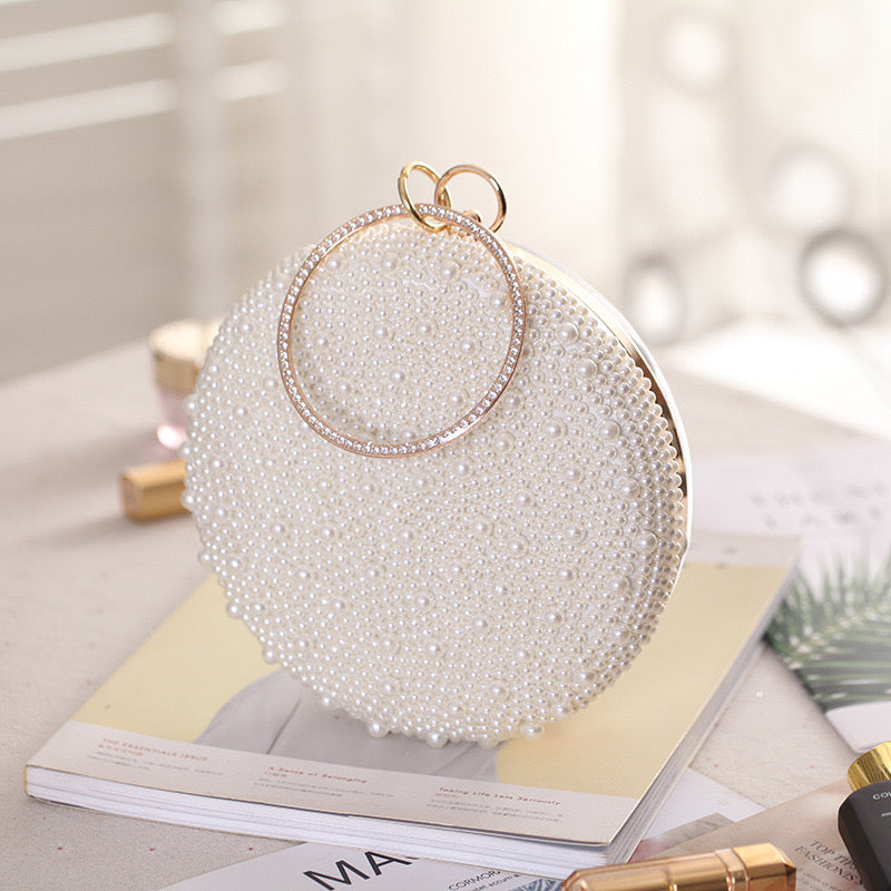 a Pearl and Diamond Evening Bag: Timeless Elegance in Hand, a sophisticated and luxurious accessory perfect for formal events and special occasions