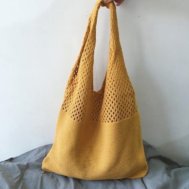 a Crochet Tote Bag, a chic and handcrafted accessory perfect for various occasions, from casual outings to beach trips.