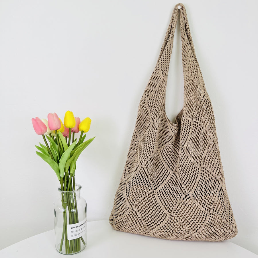 Elegant Crochet Shoulder Bag in Natural Fibers, a chic accessory for ethical fashion enthusiasts.Elegant Crochet Shoulder Bag in Natural Fibers, a chic accessory for ethical fashion enthusiasts.