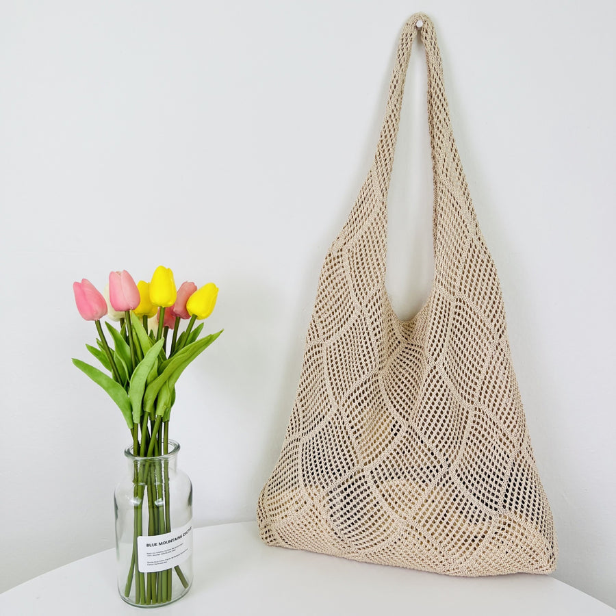 Elegant Crochet Shoulder Bag in Natural Fibers, a chic accessory for ethical fashion enthusiasts.