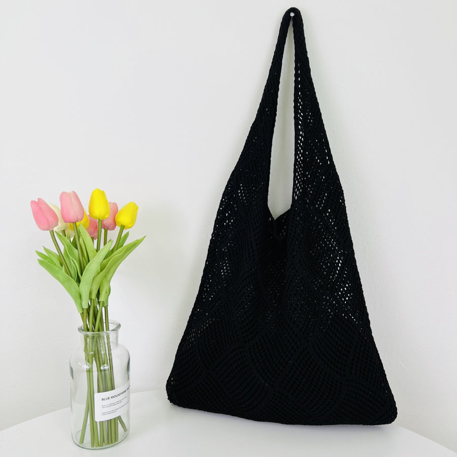 Elegant Crochet Shoulder Bag in Natural Fibers, a chic accessory for ethical fashion enthusiasts.