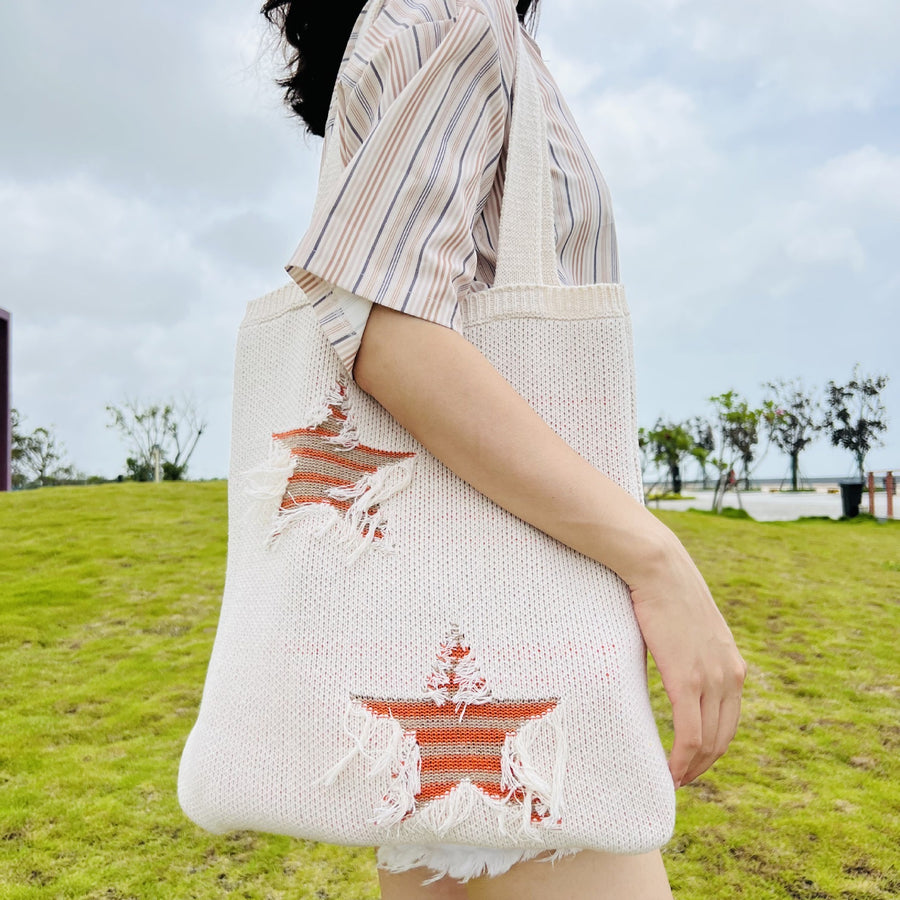 etailed Shot of a Handcrafted Crochet Shoulder Bag, showcasing its intricate patterns.