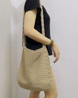 a Crochet Crossbody Bag, a stylish and eco-friendly accessory with intricate craftsmanship
