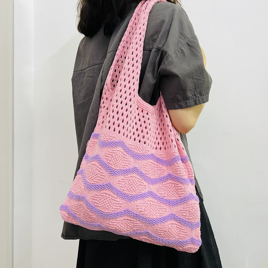 Detailed Shot of a Handcrafted Crochet Shoulder Bag, showcasing its unique patterns and craftsmanship