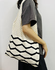 Detailed Shot of a Handcrafted Crochet Shoulder Bag, showcasing its unique patterns and craftsmanship