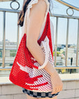Close-up of eco-friendly crochet shoulder bag featuring intricate stitchwork.