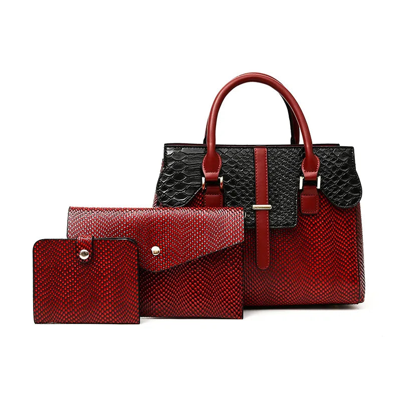 Premium red leather handbag set featuring a spacious handbag with snake-embossed details, an envelope-style clutch, and a compact wallet, all designed with textured finishes and metallic accents, displayed against a clean white background.