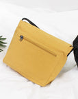 Travel in Style with Our Spacious and Lightweight Canvas Crossbody Bag