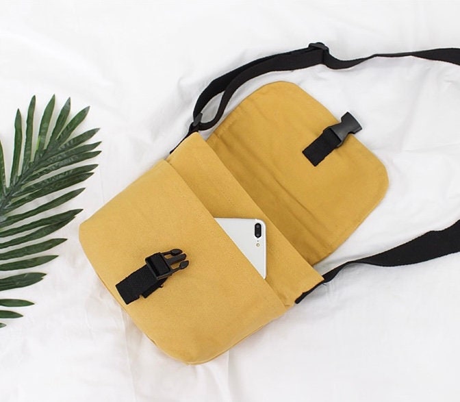 Travel in Style with Our Spacious and Lightweight Canvas Crossbody Bag