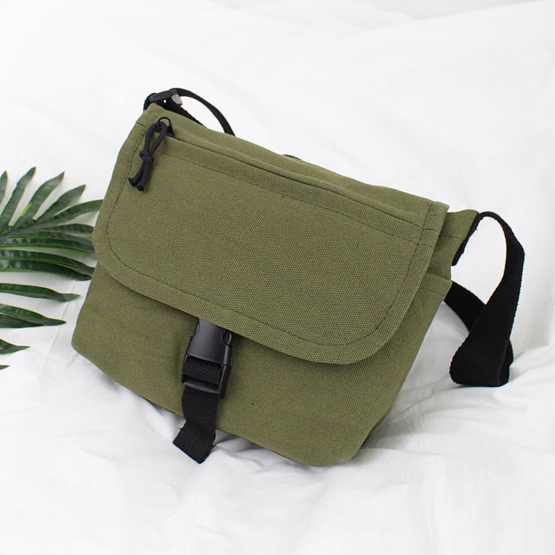 Travel in Style with Our Spacious and Lightweight Canvas Crossbody Bag