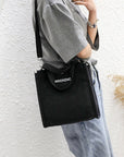 Fashionable Canvas Crossbody Bag with Flap Closure