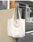 Upgrade Your Commute with Our Sleek and Minimalist Canvas Shoulder Bag