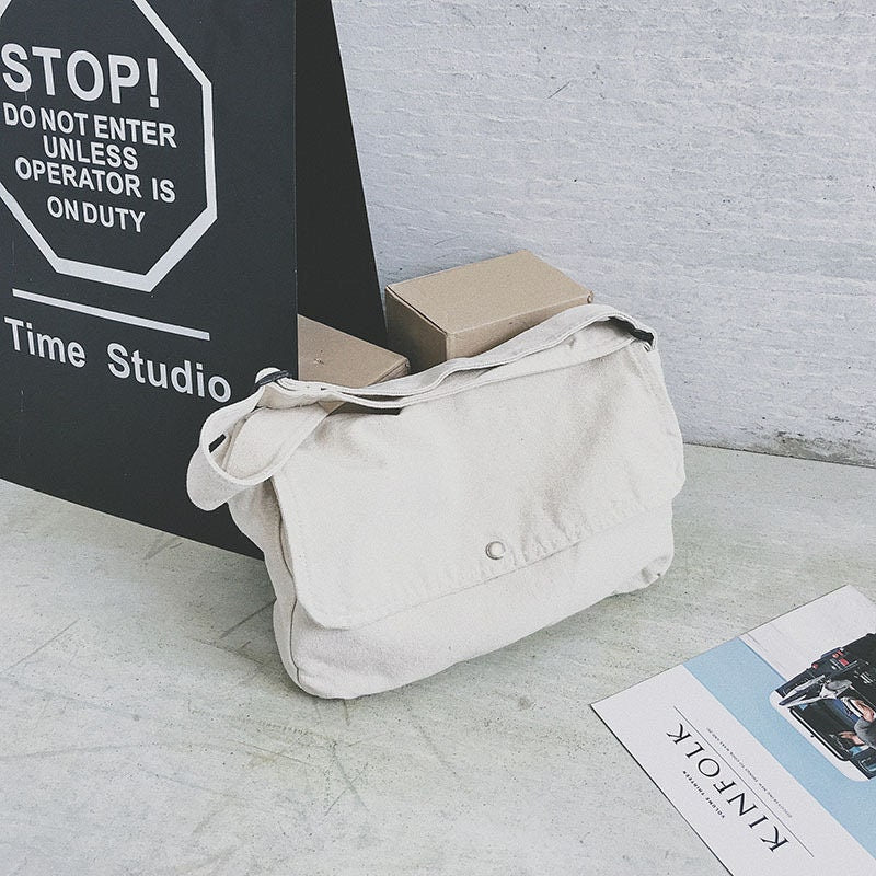 Upgrade Your Style with Our Sleek Canvas Crossbody Bag