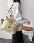 This canvas crossbody bag features a durable and lightweight construction that's perfect for everyday use.
